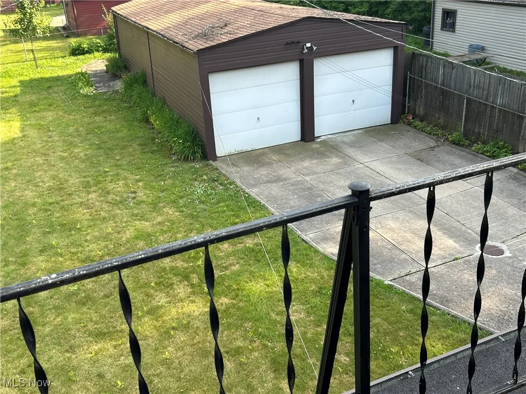 View of garage from upstairs balcony
