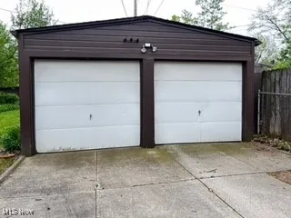 Two door garage with space for 4 cars and tool bench