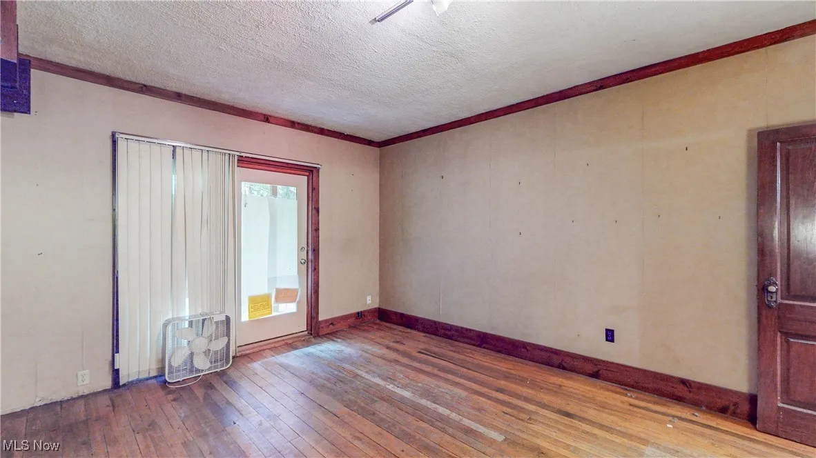 Living Room / 1st Floor BR w/hardwood flr and access to full bath