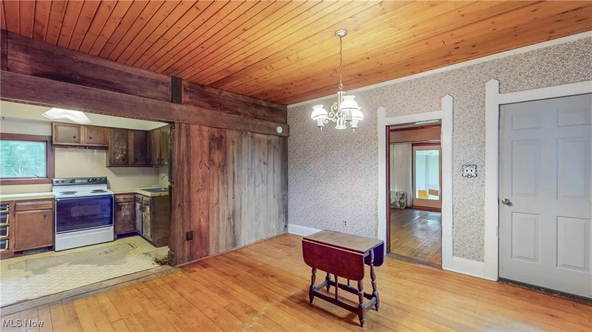 View from DR into Kitchen and to Right is access to LR & door to front porch