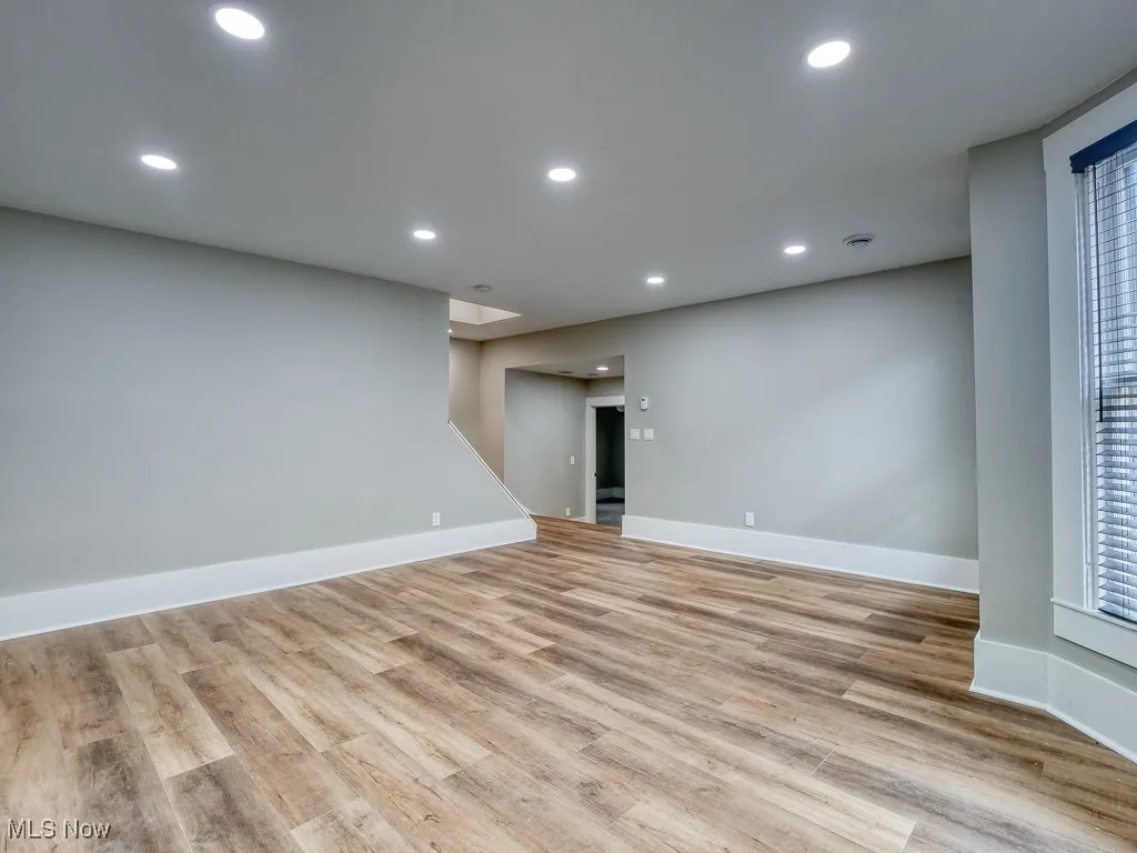 Unfurnished room featuring light wood finished floors and recessed lighting