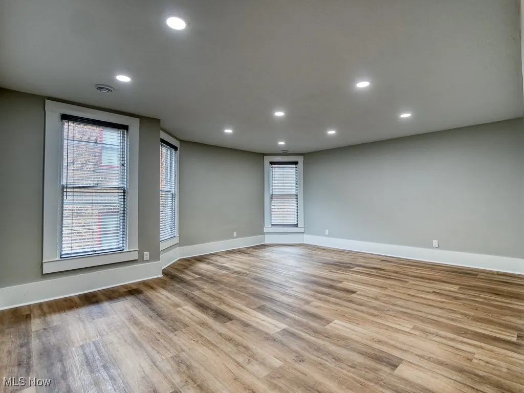 Unfurnished room with light wood-style floors and recessed lighting