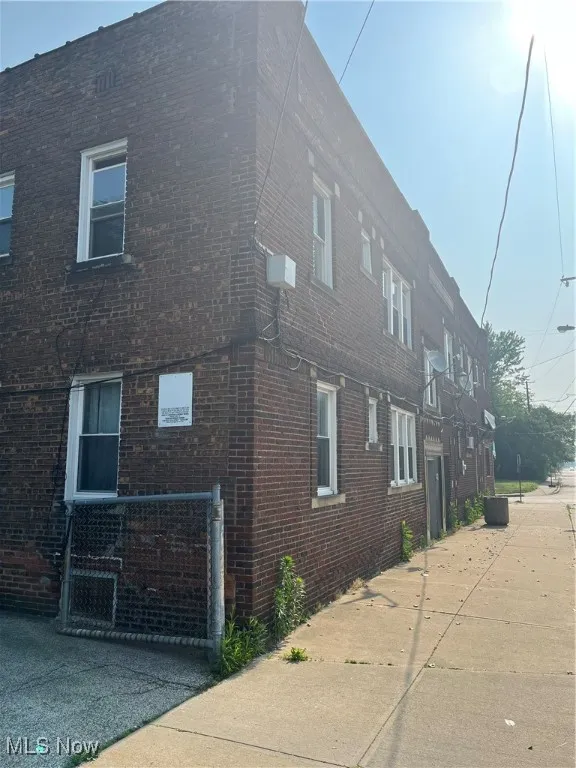 View of side of home with brick siding