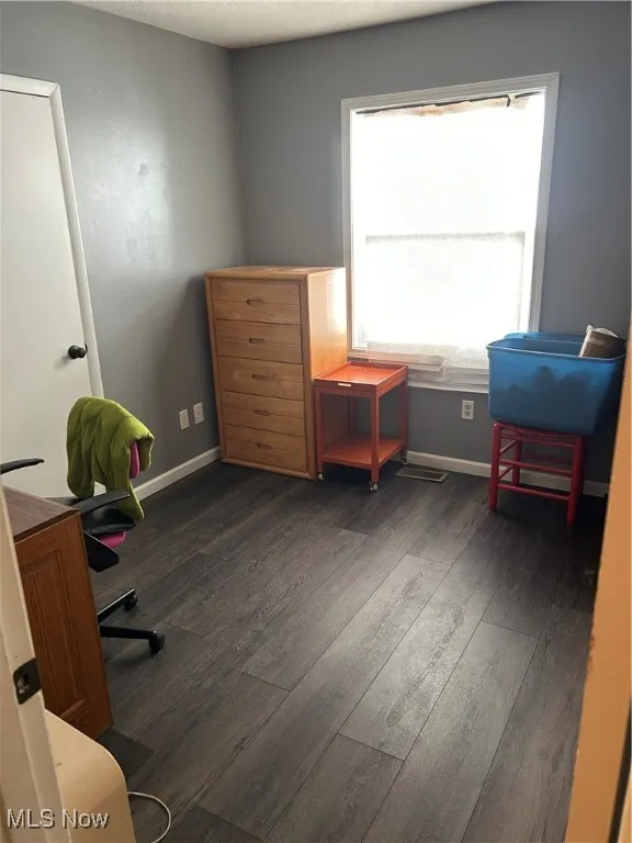 Office space featuring dark wood finished floors