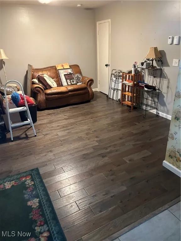 Living area with wood-type flooring and baseboards