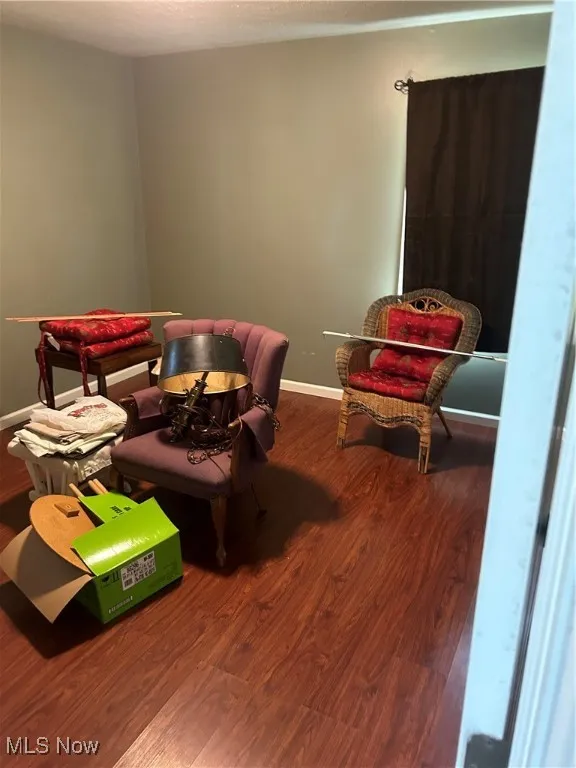 Recreation room with wood finished floors and baseboards