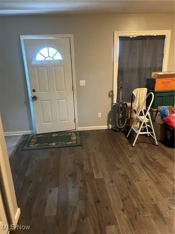 Entrance foyer featuring hardwood / wood-style floors and baseboards