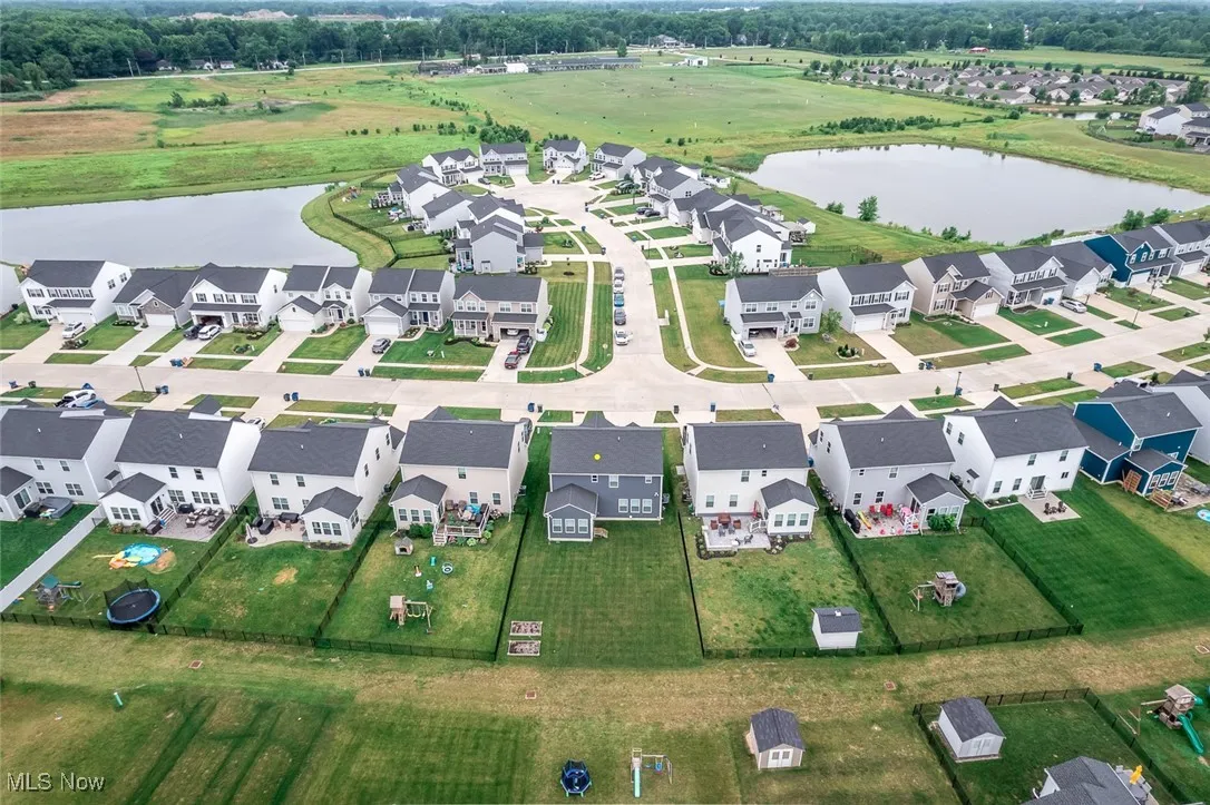 Aerial overview of property's location with nearby suburban area