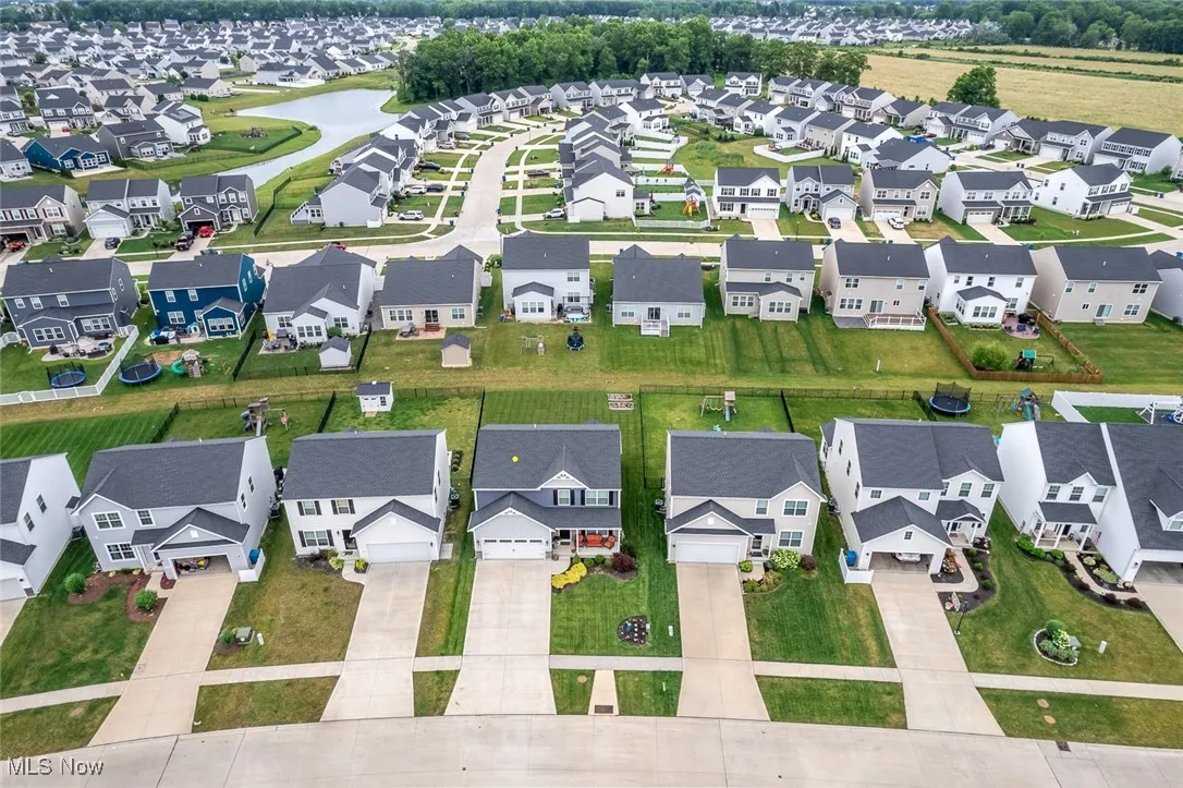 Aerial perspective of suburban area with a large body of water