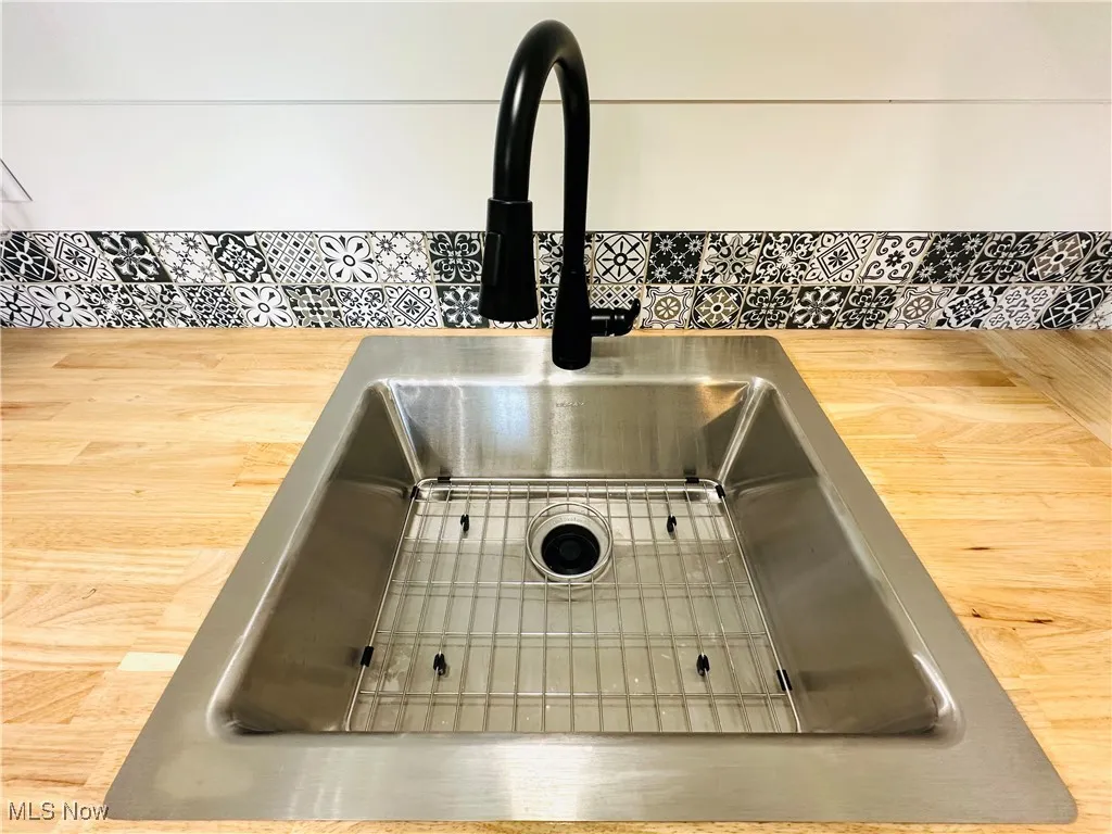 Kitchen view of farmers single bowl sink and wooden counters