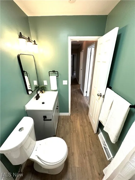 New full remodeled bath with vanity and wood like tile finished floors
