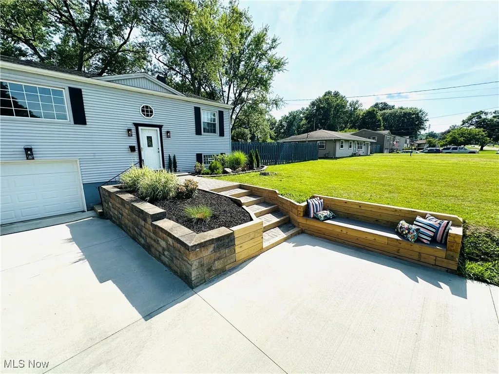 Updated modern paver/wood outlay sidewalk and outdoor bench.