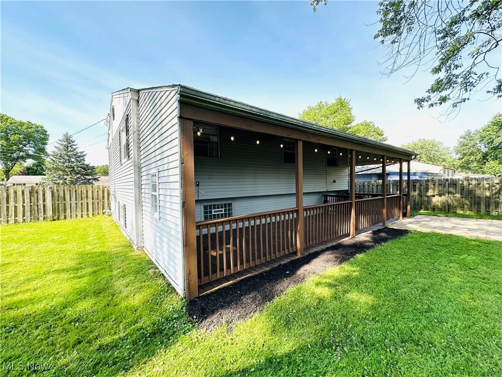 View of side of home featuring a patio