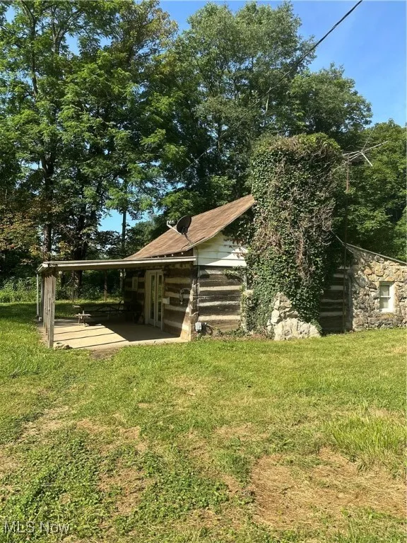 Side of structure with front covered porch