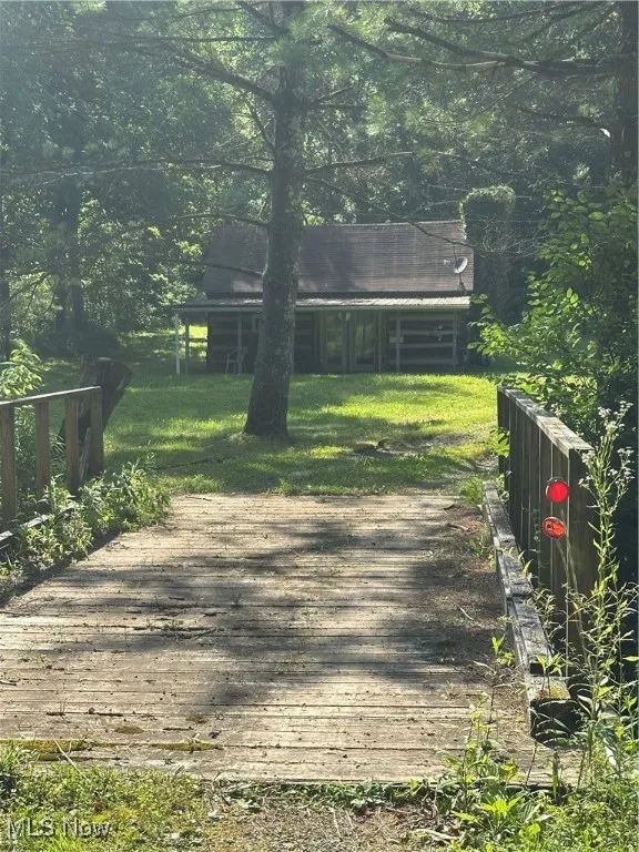 Cross over town fork creek on a wooden bridge to​​‌​​​​‌​​‌‌​‌‌​​​‌‌​‌​‌​‌​​​‌​​ property