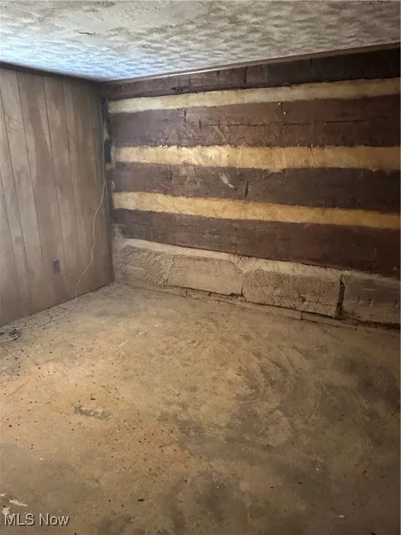 Bedroom with wooden walls