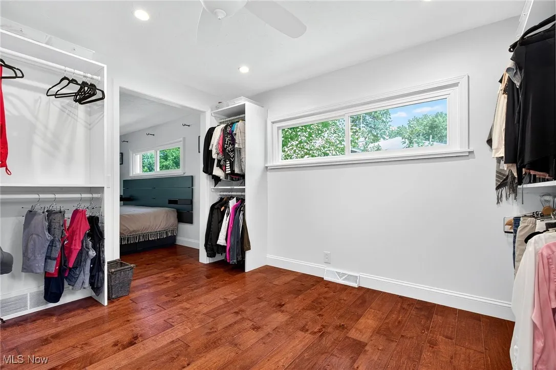 Generously sized primary suite walk-in closet