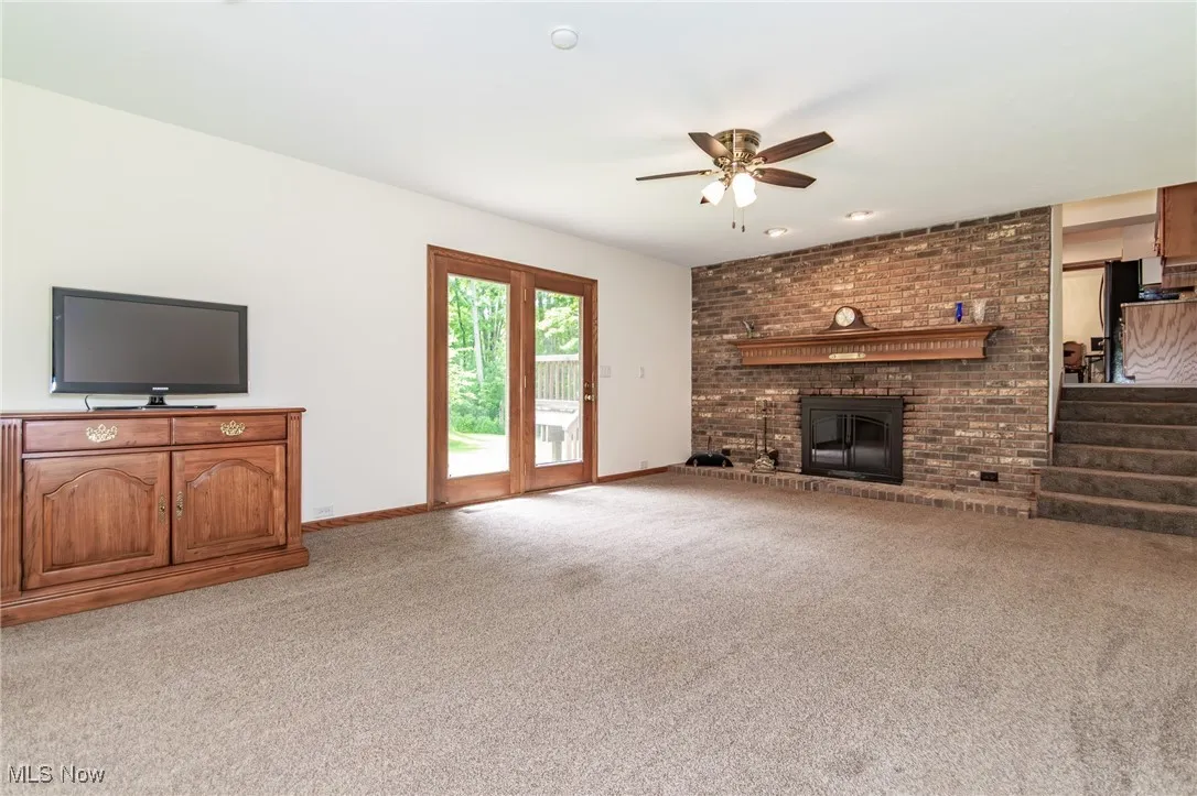 family room with fireplace and​​‌​​​​‌​​‌‌​‌‌​​​‌‌​‌​‌​‌​​​‌​​ carpet