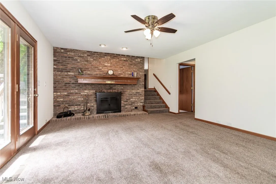 family room with fireplace and carpet