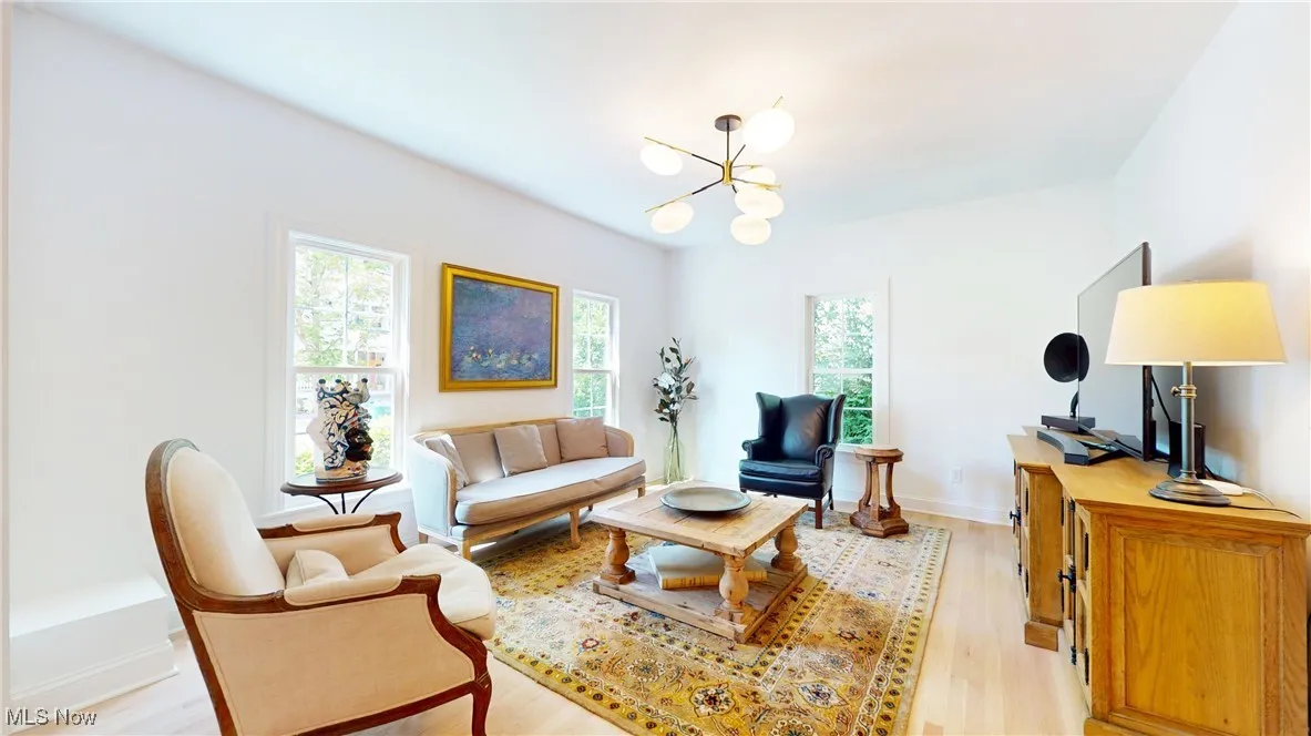 Beautiful Living room with chandelier and all new wood floors