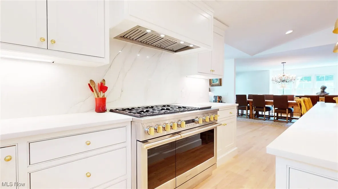 Kitchen featuring gas range with two ovens.  6 burner stop top with grill