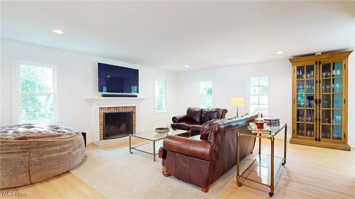 Family room with working wood firelpace and beveled sandstone hearth.