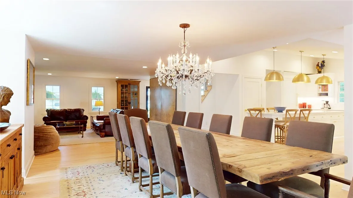 Expanded Dining room with new wood-type flooring, recessed lighting, and featuring a new Resoration Hardware crystal chandelier
