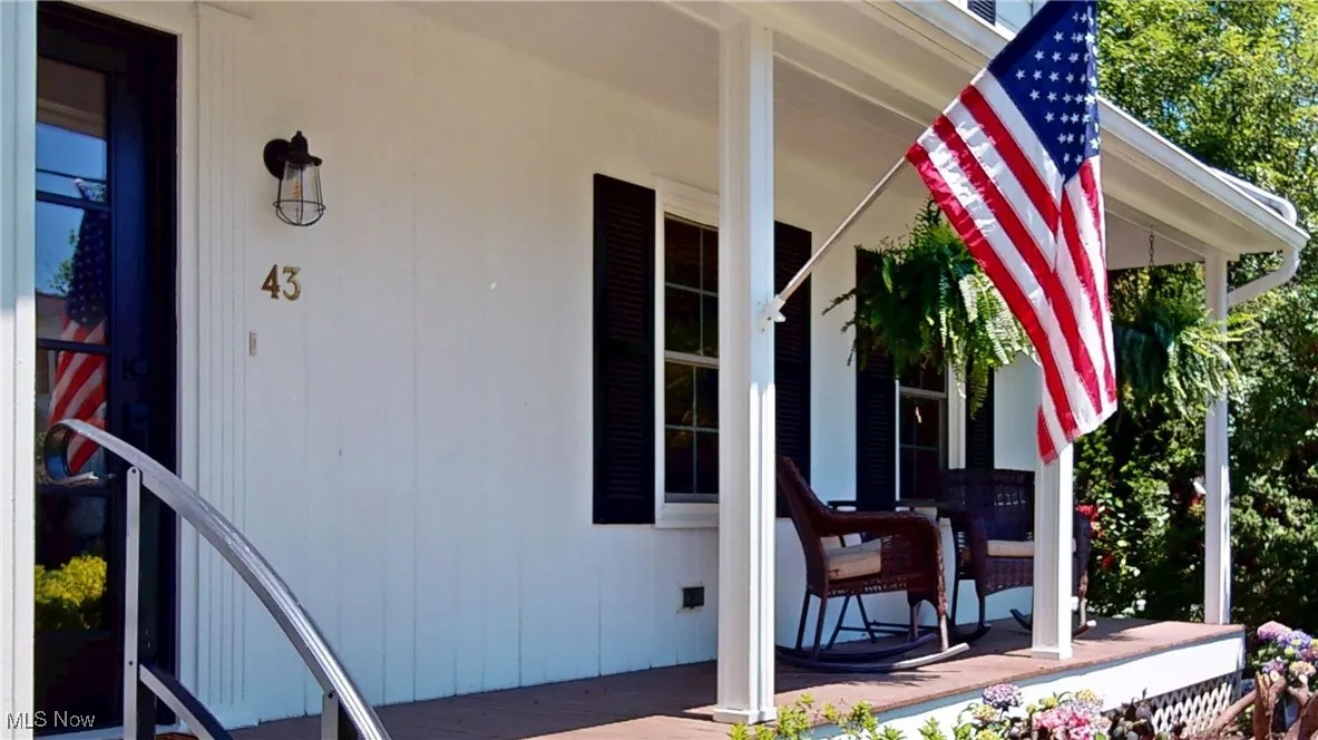 Doorway to property with relaxing front porch