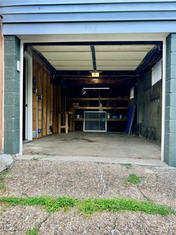 Garage featuring a garage door opener