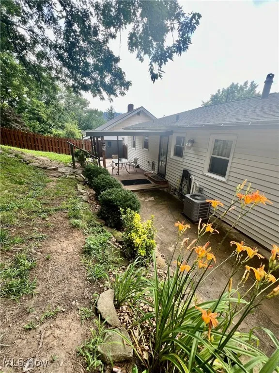 Back of property with a deck