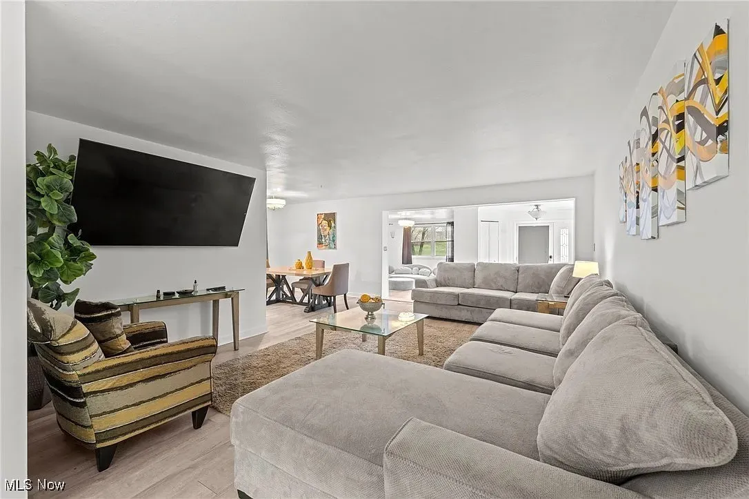 Living room with light wood-type flooring