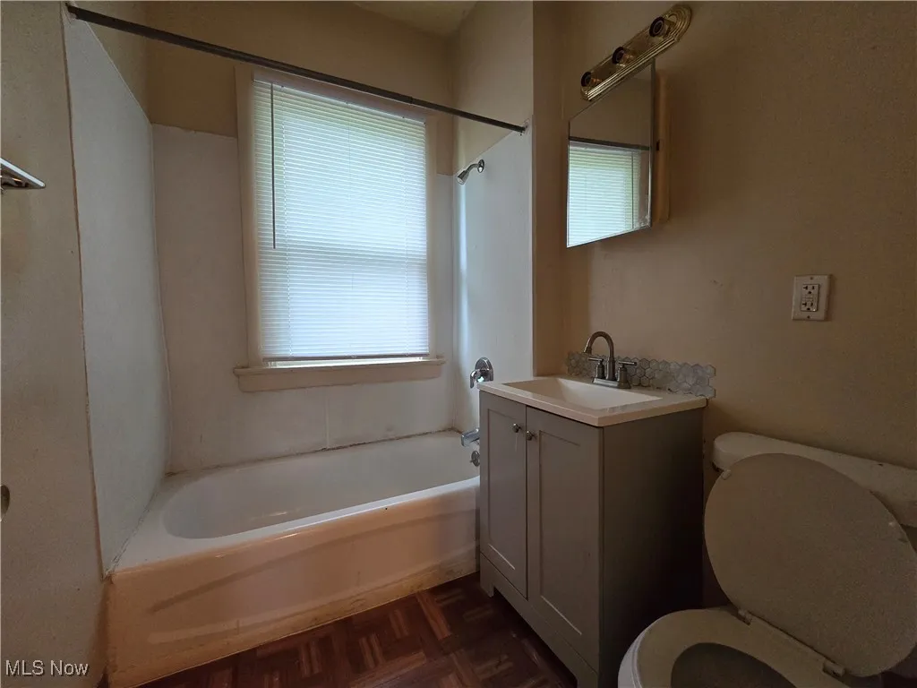 Full bath with shower / tub combination and vanity