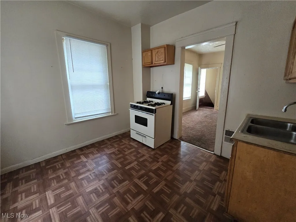 Kitchen with gas range gas stove and brown cabinets