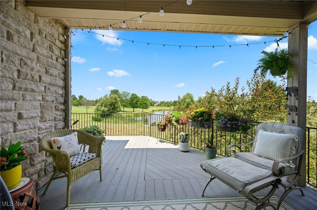 The deck wraps around the back of the home for sweeping view.