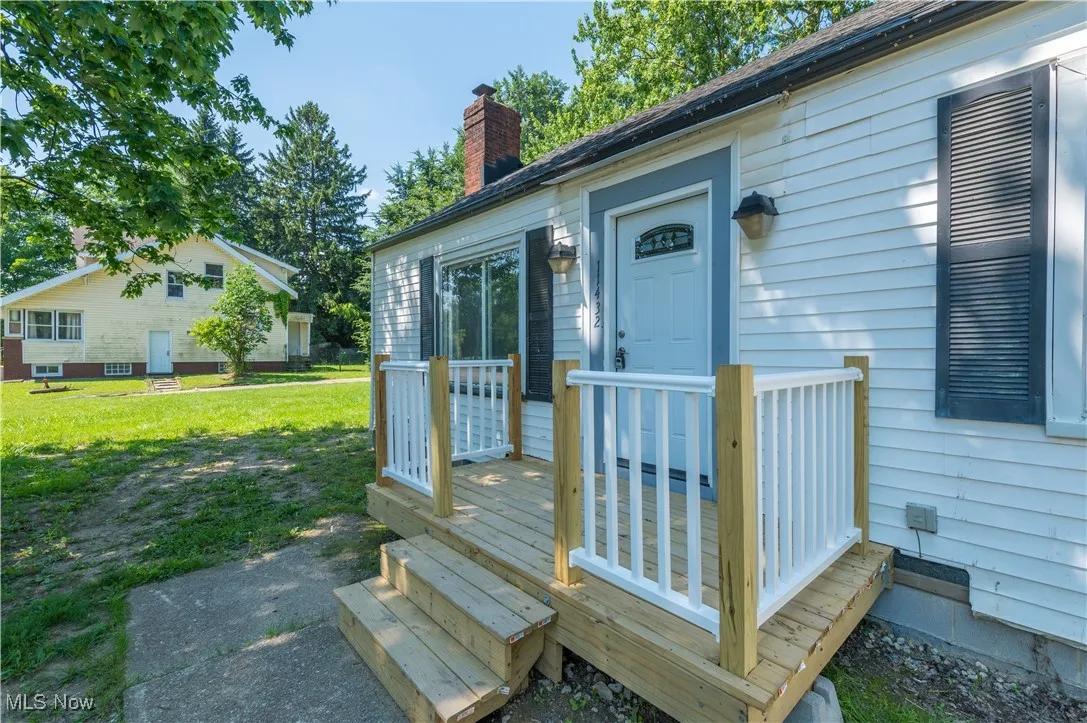 Wooden terrace with a yard