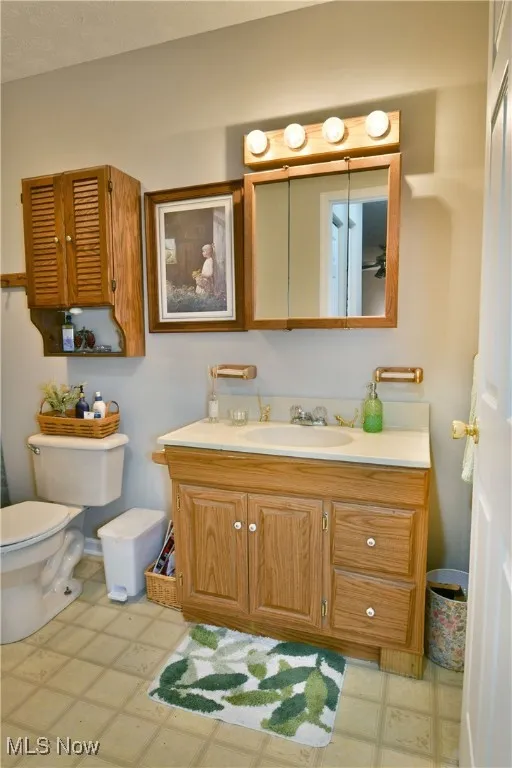 Bathroom with tile patterned floors and vanity