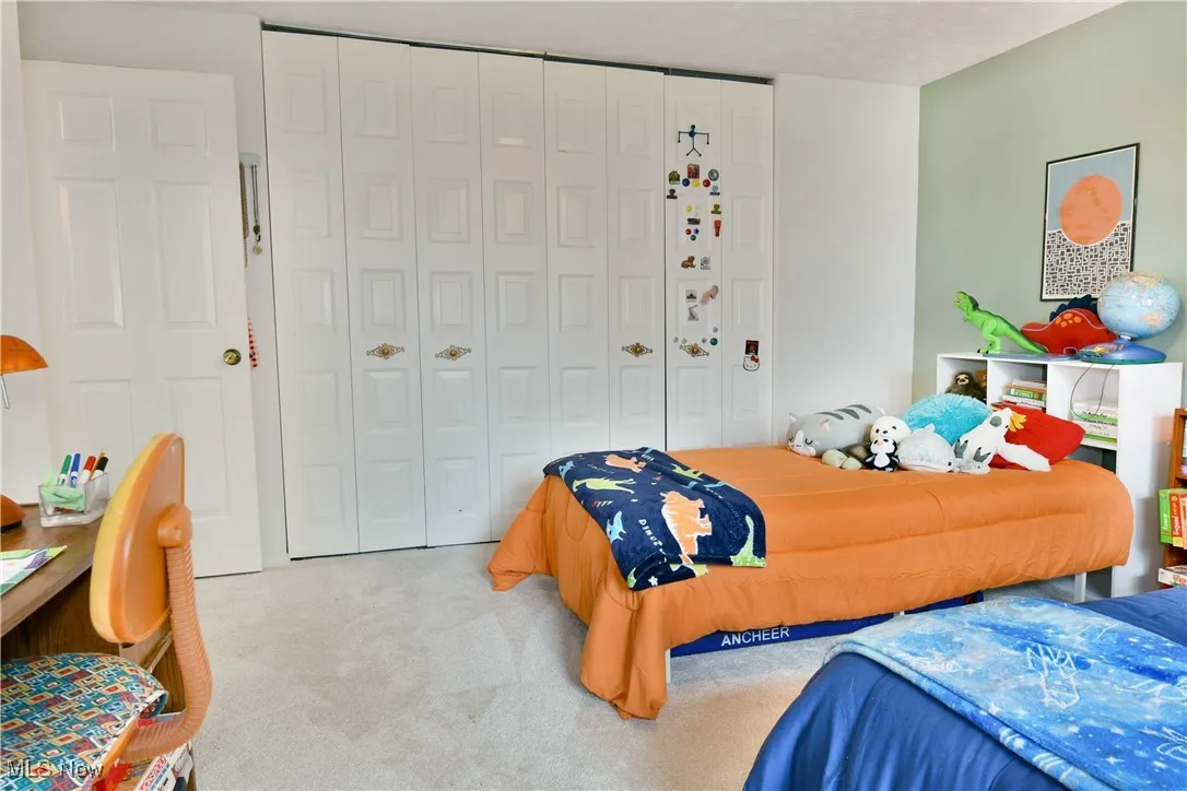 Bedroom with carpet flooring and a closet