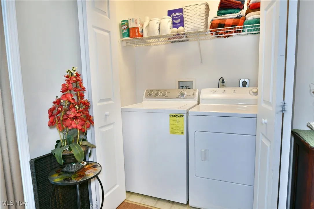 Laundry room with washing machine and clothes dryer