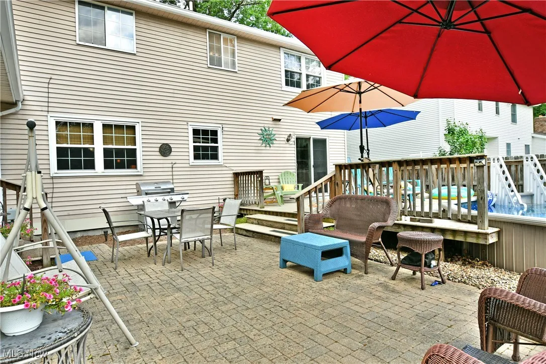 View of patio / terrace featuring outdoor dining area, grilling area, and a deck