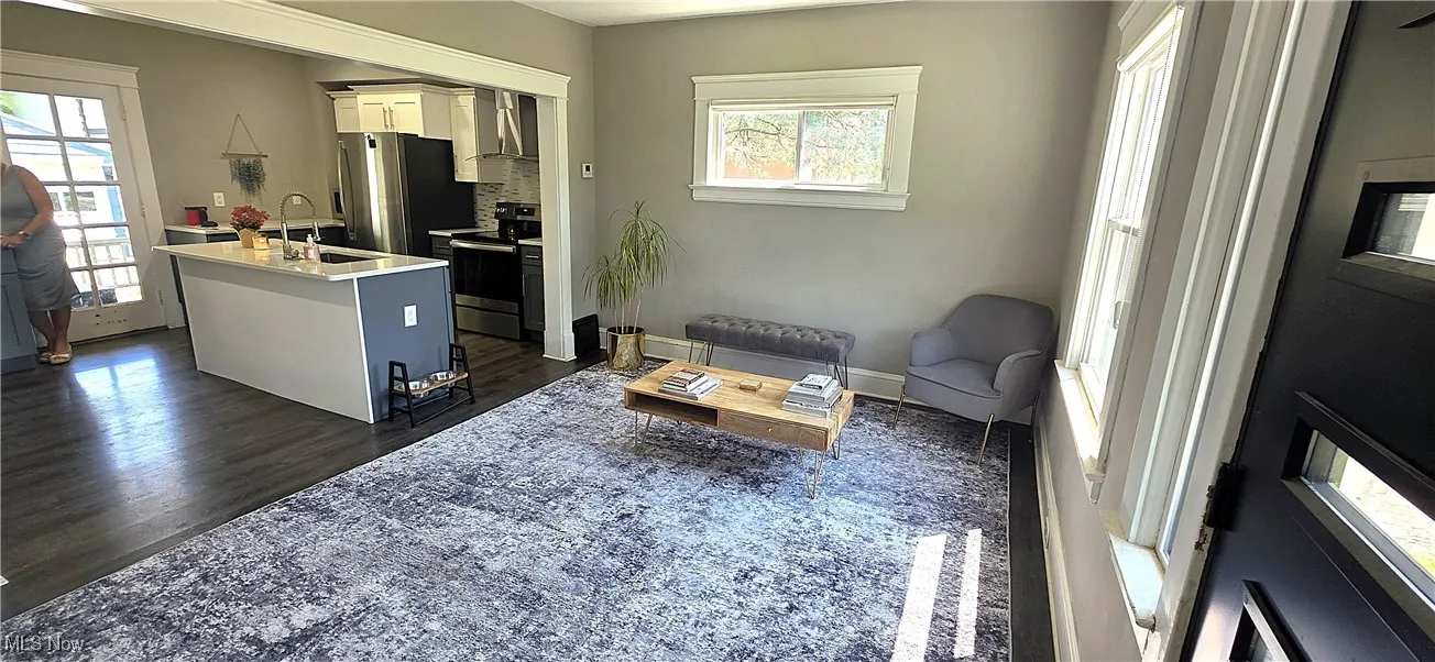 Living area featuring dark wood-type flooring