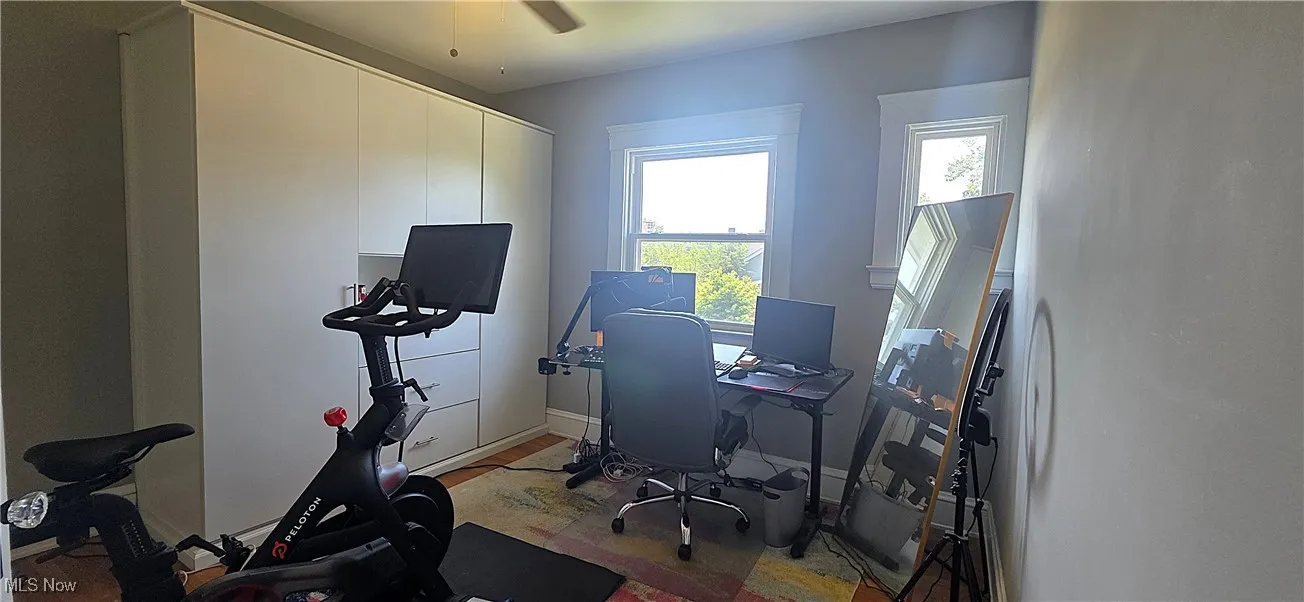Bedroom with wood finished floors and a ceiling fan