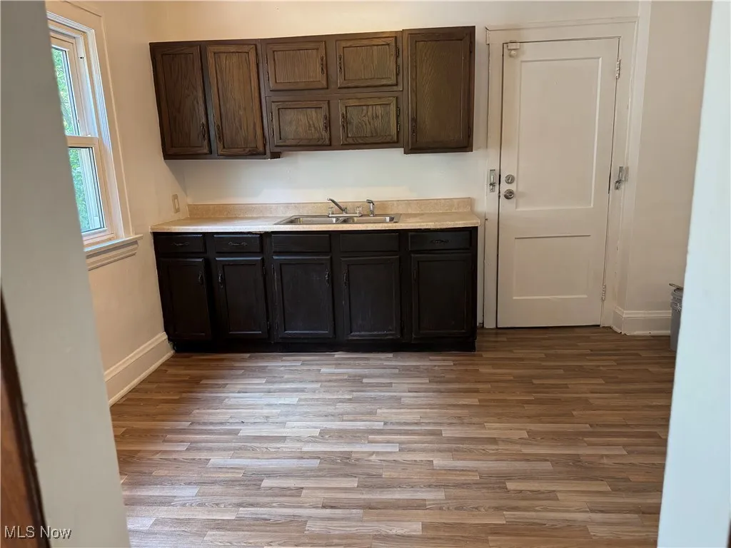 Kitchen featuring light wood finished floors and light countertops