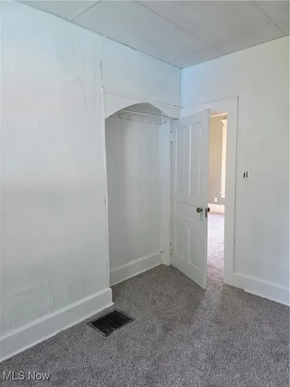 Empty room featuring carpet floors