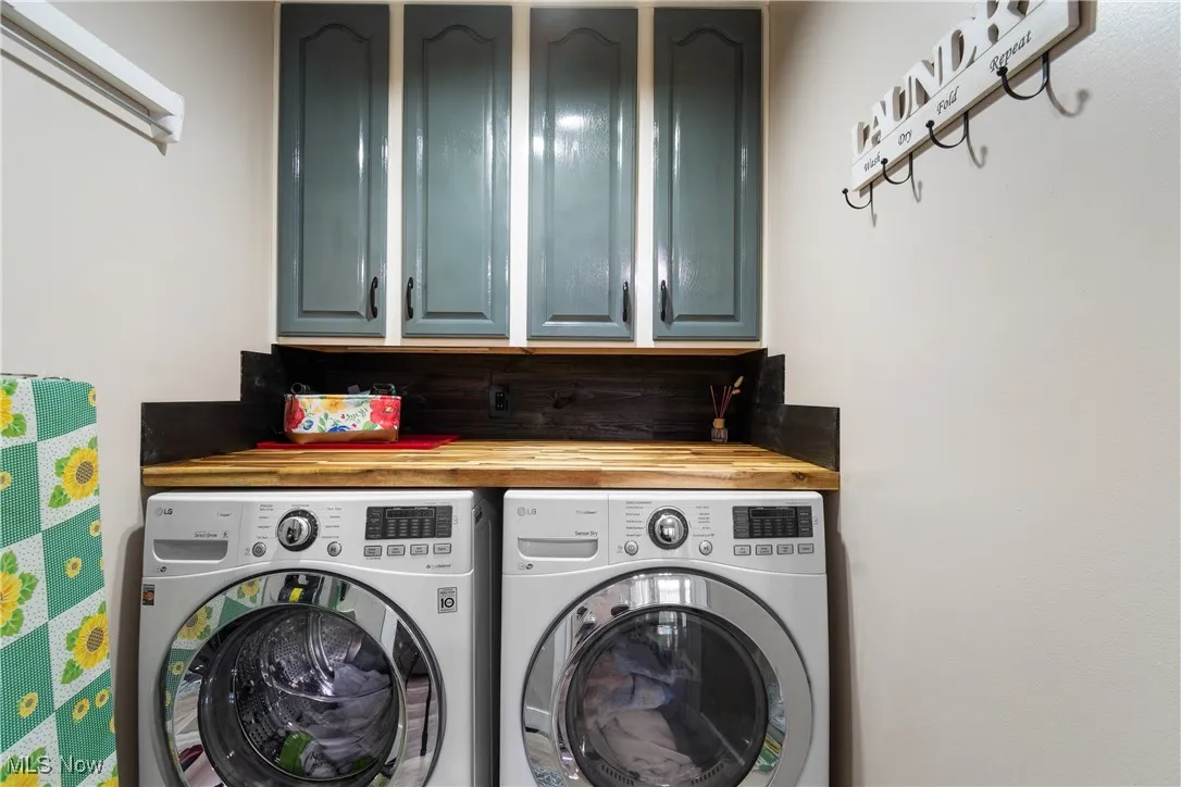 Laundry area with washing machine and dryer and cabinet space