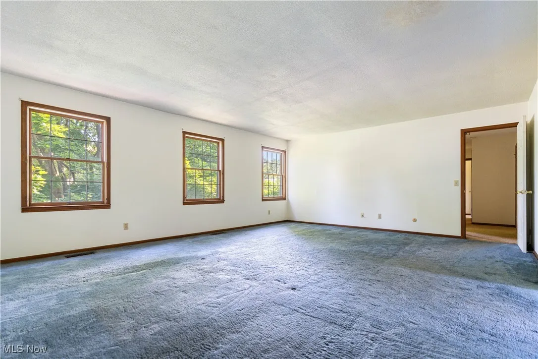 View of the primary bedroom.  We want you to see how much natural light in this home.
