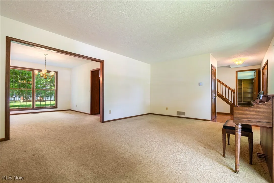 This view of the family room shows how the home flows with the dining room area as well as the foyer and family room.   Great space.