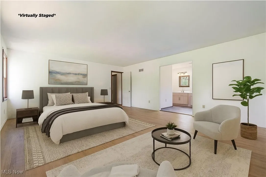 Virtually Staged and redesigned.  If you wanted to change flooring, he is an option for this Primary Bedroom.