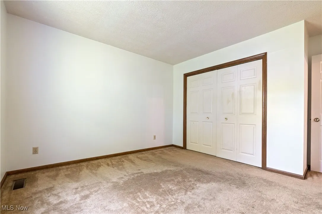 Another view of bedroom 3.   View of the double closet.
