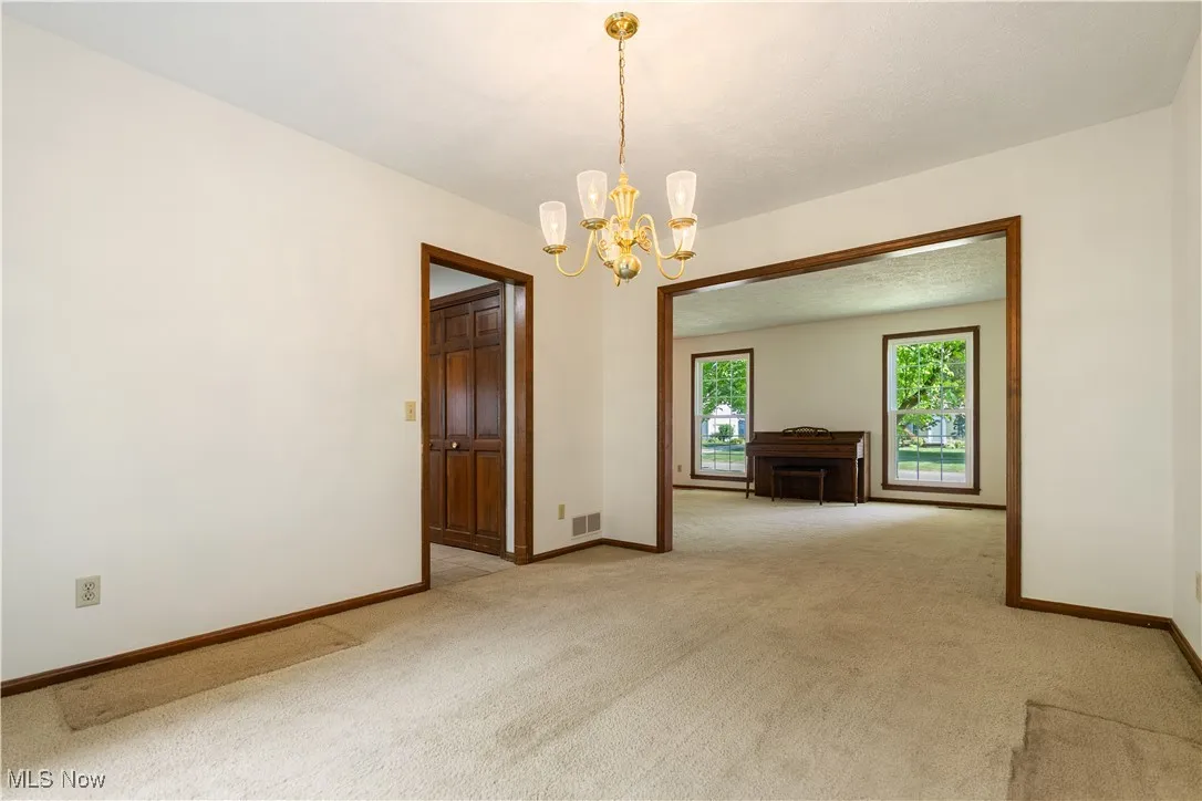 This is a view of the dining room area and shows how it flows with the family room and kitchen.