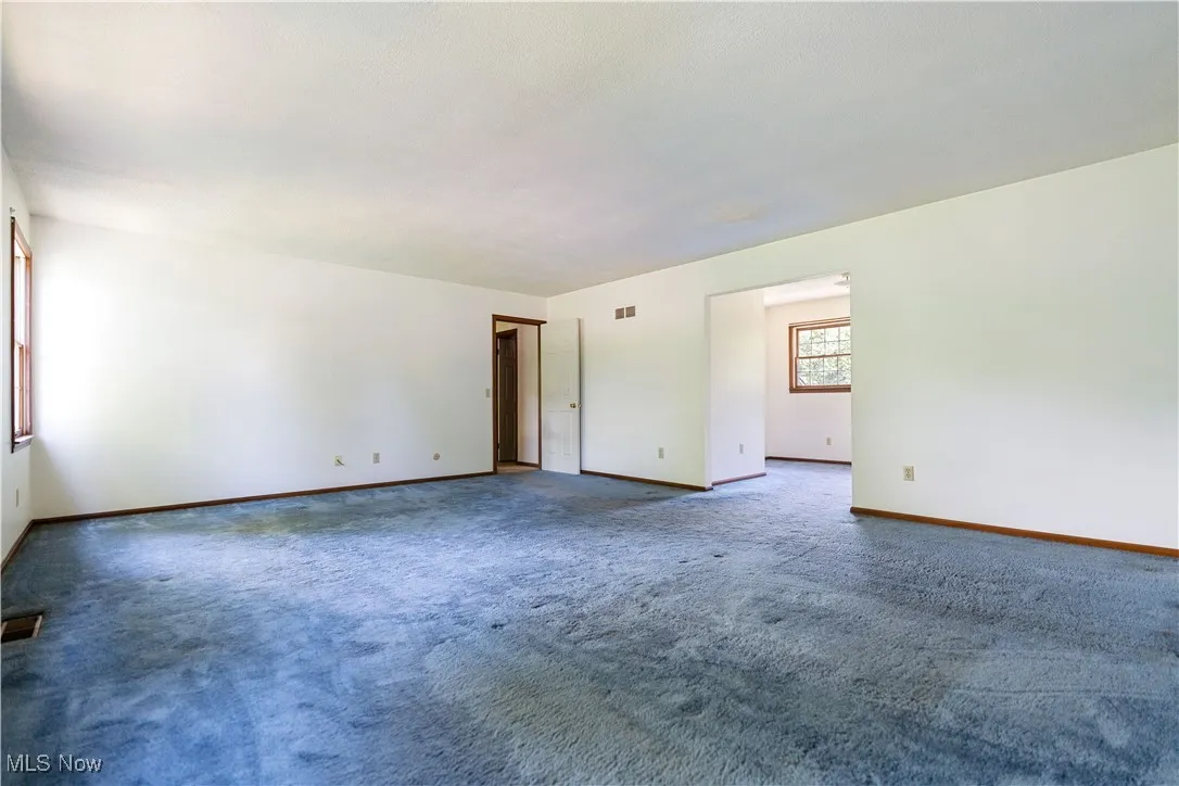View of the primary suite.  A large room.  Look to the right, this will take you to the primary bath to the left, to the right a large walk in closet.